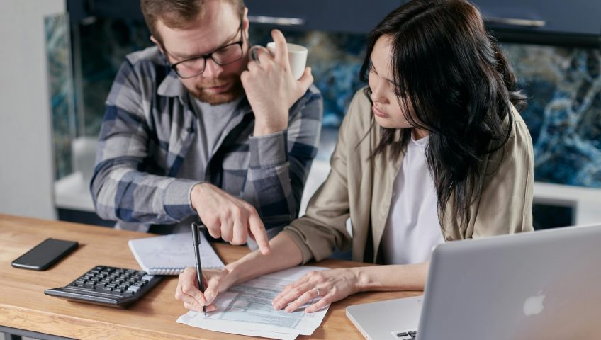 Free couple calculating al their bills stock photo